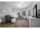 Bedroom with hardwood floors, soft gray walls and a ceiling fan, perfect for a new Gathering at 2272 Se Laurel Run Dr, Ocala, FL 34471