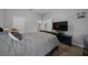 Spacious bedroom with wood floors, neutral paint, and a view of the Primary bathroom at 2272 Se Laurel Run Dr, Ocala, FL 34471