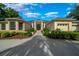 Stately home featuring a circular driveway, manicured landscaping, and a grand entrance with classic columns at 2272 Se Laurel Run Dr, Ocala, FL 34471