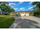 Beautiful home with a manicured lawn and a spacious three-car garage at 2272 Se Laurel Run Dr, Ocala, FL 34471