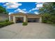 Spacious three-car garage with ample storage space and durable flooring at 2272 Se Laurel Run Dr, Ocala, FL 34471
