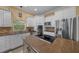 Kitchen features a cooktop, lots of cabinets, and stainless steel appliances at 2272 Se Laurel Run Dr, Ocala, FL 34471