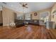 Bright living room features multiple windows with beautiful hardwood floors and comfortable furnishings at 2272 Se Laurel Run Dr, Ocala, FL 34471