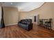 Living room featuring hardwood floors and a comfortable leather recliner at 2272 Se Laurel Run Dr, Ocala, FL 34471
