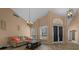 Living room with high ceilings, tile floors, natural light from windows, and comfortable seating arrangements at 2272 Se Laurel Run Dr, Ocala, FL 34471