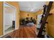 Home office with hardwood floors, lots of natural light and an adjacent bathroom with a shower at 2272 Se Laurel Run Dr, Ocala, FL 34471