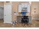 Built-in desk features cabinets and drawers plus plenty of storage and a wall-mounted computer monitor at 2272 Se Laurel Run Dr, Ocala, FL 34471