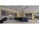 The outdoor bar in the screened patio is perfect for entertaining with lots of counter space at 2272 Se Laurel Run Dr, Ocala, FL 34471