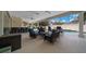 Relaxing screened-in patio with ceiling fans, sitting area and outdoor bar overlooking the pool at 2272 Se Laurel Run Dr, Ocala, FL 34471