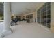 A stunning view of the screened-in patio, an entertainer's dream, with access to the pool at 2272 Se Laurel Run Dr, Ocala, FL 34471