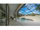 This angled view of the pool shows the large patio space with columns and covered areas at 2272 Se Laurel Run Dr, Ocala, FL 34471