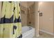 Shower and tub with shower curtain and tile surround at 2272 Se Laurel Run Dr, Ocala, FL 34471