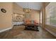 Sitting room features a wet bar, tile flooring, a comfortable couch, and a well lit, neutral color pallette at 2272 Se Laurel Run Dr, Ocala, FL 34471