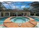 A relaxing spa with tiled surround that is part of the beautiful pool at 2272 Se Laurel Run Dr, Ocala, FL 34471