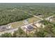 Expansive aerial view of a house on a large lot with mature trees and an outbuilding in the rear at 23131 Sw Rainelle Rd, Dunnellon, FL 34431