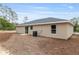 A well-maintained single-story home features a lush backyard with mature trees, offering a serene and private outdoor space at 23131 Sw Rainelle Rd, Dunnellon, FL 34431