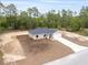 Charming single-story home with a well-manicured lawn and a long driveway leading to an attached garage at 23131 Sw Rainelle Rd, Dunnellon, FL 34431