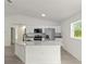 Modern kitchen featuring stainless steel appliances and granite countertops at 23131 Sw Rainelle Rd, Dunnellon, FL 34431