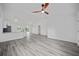Bright, open-concept living space with sleek flooring and modern design at 23131 Sw Rainelle Rd, Dunnellon, FL 34431