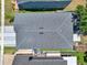 Aerial view showcases the roof of a home, highlighting its architectural design and condition at 2525 Sand Arbor Cir, Orlando, FL 32824