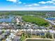 An aerial view of a neighborhood surrounded by lakes and green spaces at 2525 Sand Arbor Cir, Orlando, FL 32824