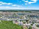 A picturesque aerial view of a community nestled among serene lakes and lush greenery at 2525 Sand Arbor Cir, Orlando, FL 32824