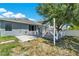 A spacious backyard, including a paver patio and a covered deck, perfect for relaxation and entertainment at 2525 Sand Arbor Cir, Orlando, FL 32824