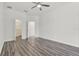 Bedroom featuring wood floors, a closet, and a doorway, creating a cozy and functional space at 2525 Sand Arbor Cir, Orlando, FL 32824