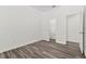 This spacious bedroom includes gray wood floors, a closet, and an entryway for added convenience at 2525 Sand Arbor Cir, Orlando, FL 32824