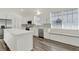 Bright kitchen featuring white cabinets, stainless steel appliances, and a window seat at 2525 Sand Arbor Cir, Orlando, FL 32824