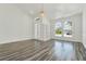 Spacious living room with wood floors, built-in shelves, and bright arch windows at 2525 Sand Arbor Cir, Orlando, FL 32824