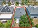 Aerial view of backyard featuring a paver patio, small storage, and partial fencing at 2525 Sand Arbor Cir, Orlando, FL 32824