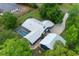 Aerial view showcases home with pool, lush landscaping and ample lawn space at 260 Country Circle W Dr, Port Orange, FL 32128