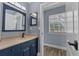 This bathroom features a vanity with storage, stylish mirror, and sleek fixtures at 260 Country Circle W Dr, Port Orange, FL 32128