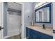 Bathroom showcasing a tub, vanity with storage, stylish mirror, and sleek fixtures at 260 Country Circle W Dr, Port Orange, FL 32128