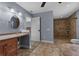 A bathroom featuring dual sinks, tile floors, a walk-in shower, and a linen closet at 260 Country Circle W Dr, Port Orange, FL 32128