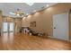 Spacious bonus room features hardwood floors, ceiling fan, and french doors for flexible living at 260 Country Circle W Dr, Port Orange, FL 32128