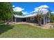 Home exterior with metal roof, rock landscaping, and green grass at 260 Country Circle W Dr, Port Orange, FL 32128