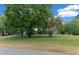 Beautiful home with a well-maintained lawn and mature trees in a quiet neighborhood at 260 Country Circle W Dr, Port Orange, FL 32128