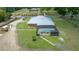 Expansive screened-in pool and spa area, set within the lush, well-manicured lawn of this estate at 3934 Se 110Th St, Belleview, FL 34420