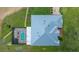 Overhead view featuring a pool, a screen enclosed lanai and a light-colored roof at 3934 Se 110Th St, Belleview, FL 34420