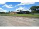 Exterior view of a home with screened-in pool, spacious backyard, and serene surroundings at 3934 Se 110Th St, Belleview, FL 34420
