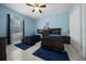 Comfortable bedroom featuring two queen beds, tile floors and ceiling fan at 3934 Se 110Th St, Belleview, FL 34420