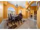 Bright dining area with large arched window and unique ceiling details at 3934 Se 110Th St, Belleview, FL 34420