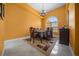 Elegant dining room with large window and chandelier, perfect for entertaining at 3934 Se 110Th St, Belleview, FL 34420
