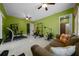 Exercise room with ample workout equipment, a comfortable sofa, and plenty of natural light at 3934 Se 110Th St, Belleview, FL 34420