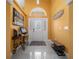 Bright and inviting foyer featuring tile flooring, art niche and decorative wall accents at 3934 Se 110Th St, Belleview, FL 34420