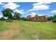 Beautifully landscaped yard with mature trees and long driveway at 3934 Se 110Th St, Belleview, FL 34420