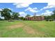 Charming single-story home with stucco exterior, large lawn, and mature trees in a serene setting at 3934 Se 110Th St, Belleview, FL 34420
