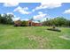Spacious front yard, lovely landscaping and an inviting porch at 3934 Se 110Th St, Belleview, FL 34420